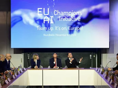France's President Emmanuel Macron addresses investors next to German chancellor Friedrich Merz and Managing director and Head of Europe at General Catalyst Jeannette zu Fürstenberg at the EU AI Champions Initiative at a summit on Europe's technological sovereignty, in the EUREF Campus in Berlin, Germany, November 18, 2025. JOHN MACDOUGALL/Pool via REUTERS