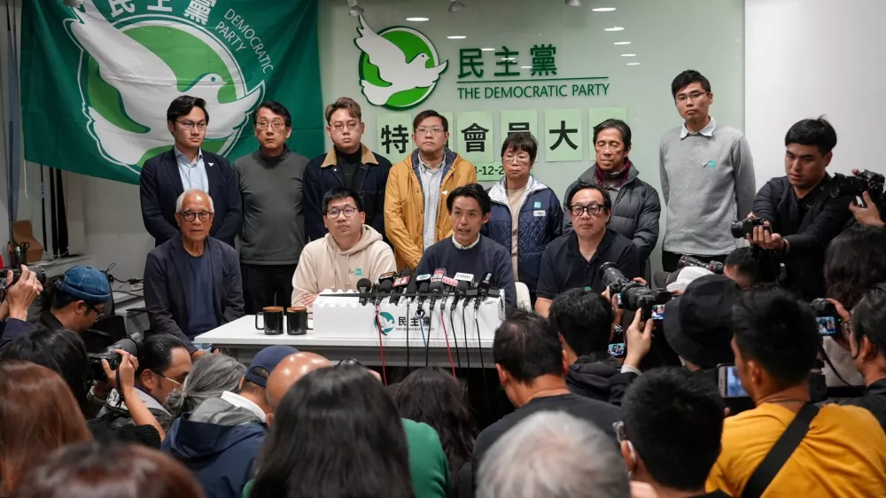 Lo Kin-hei, chairman of Hong Kong's Democratic Party, and other party members attend a press conference following an extraordinary general meeting to vote on the party's dissolution, in Hong Kong, China December 14, 2025. REUTERS/Joyce Zhou