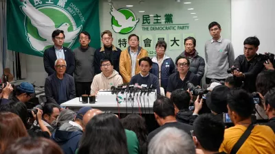 Lo Kin-hei, chairman of Hong Kong's Democratic Party, and other party members attend a press conference following an extraordinary general meeting to vote on the party's dissolution, in Hong Kong, China December 14, 2025. REUTERS/Joyce Zhou