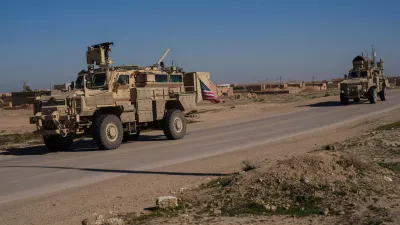 FILE - A U.S. military convoy drives along a road in northeastern Syria's Hasakeh province, Thursday, Jan. 30, 2025. (AP Photo/Bernat Armangue, File)
