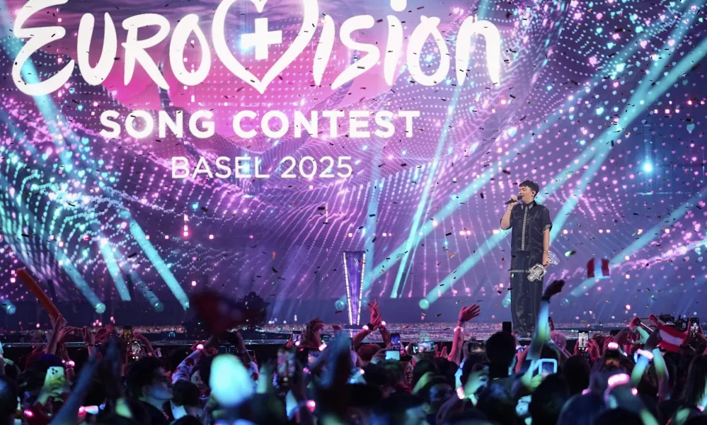 JJ from Austria stands on the stage with the trophy after winning the Grand Final of the 69th Eurovision Song Contest, in Basel, Switzerland, Saturday, May 17 2025. (AP Photo/Martin Meissner)
