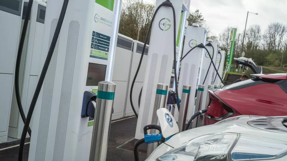 2XBHF6A Electric Vehicles charging at Annandale motorway service station on the A74 (M) near Lockerbie Scotland