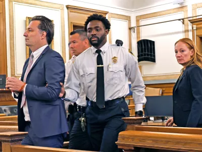 Brian Walshe, left, is escorted out of court after being found guilty of the first degree murder of his wife Ana in 2023 by a Norfolk Superior Court jury in Dedham, Mass., on Monday, Dec. 15, 2025. (Greg Derr/The Patriot Ledger via AP, Pool)