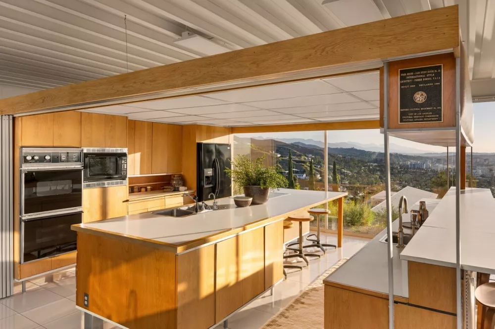 Story from Jam Press (Famous Hollywood House)Pictured: LA's Iconic Stahl House, also known as Case Study House #22.Famous Hollywood Stahl house hits market for the first time in 65 YEARSA luxurious house in Hollywood belonging to the famous Stahl family has hit the market for the first time in 65 years.And it comes with an impressive history.The home dates back to 1958, when it was commissioned by the Arts and Architecture magazine.It was part of a series of Case Study properties that were built as an experimental solution to the post-war housing boom.And not long after, it was snapped by the C.H. "Buck" Stahl, who was a painter, graphic designer and professional football player, reports&nbsp;Luxury Property News.It was made famous by photographer Julius Shulman, who pictured two women lounging in the home, as well as featuring in television shows and films such as Galaxy Quest, Columbo and Nurse Betty.The Stahl House &ndash;&nbsp;or Case Study House #22 &ndash;&nbsp;is located in the heart of Hollywood Hills; just a mile away from Sunset Strip.It boasts 270-degree views of Los Angeles and sprawls across 2,200 sq ft.Inside, the design is modern and simple.Dark brown tones contrast against beige walls, ceilings and flooring &ndash;oozing a sense of luxury.In the kitchen, a plaque is proudly positioned to mark its title in history, crowning it a historic-cultural monument.Glass walls adorn the place from top-to-bottom, allowing natural sunlight to flow through and further expand the open-plan living space.A central fireplace in the living room is great for entertaining guests on a cold evening.And access to outside via sliding doors brings focus onto the expansive swimming pool.Then, the money shot, the view of the city's twinkling lights.Pierre Koenig, who crafted the home, made sure it was one-of-a-kind; including frames of the Hollywood Sign from the bathroom.Accessed via a gated drive, privacy and security is at the forefront of its design.And with neighbours including Leonardo DiCaprio, Kenau Reeves, Halle Berry and Taylor Swift, it's a certain showstopper.The current owners have offered public tours since 2007 &ndash;&nbsp;but now, for the first time in 65 years, it's on the market for a cool 5m (USD) (Ł18.6m).The listing, which features on&nbsp;Top 10 Real Estates, is held by William Baker of the Agency Beverly Hills.ENDSEDITOR'S NOTE: All press must include mention of Top 10 Real Estate Deals as per condition of use. Digital press must hyperlink where possible:&nbsp;https://toptenrealestatedeals.com/weekly-ten-best-home-deals/home/las-iconic-stahl-house-most-famous-us-modern-home-since-fallingwater-lists-for-25-million,Image: 1059667947, License: Rights-managed, Restrictions: EDITOR'S NOTE: All press must include mention of Top 10 Real Estate Deals as per condition of use. Digital press must hyperlink where possible:&nbsp;https://toptenrealestatedeals.com/weekly-ten-best-home-deals/home/las-iconic-stahl-house-most-famous-us-modern-h, Model Release: no