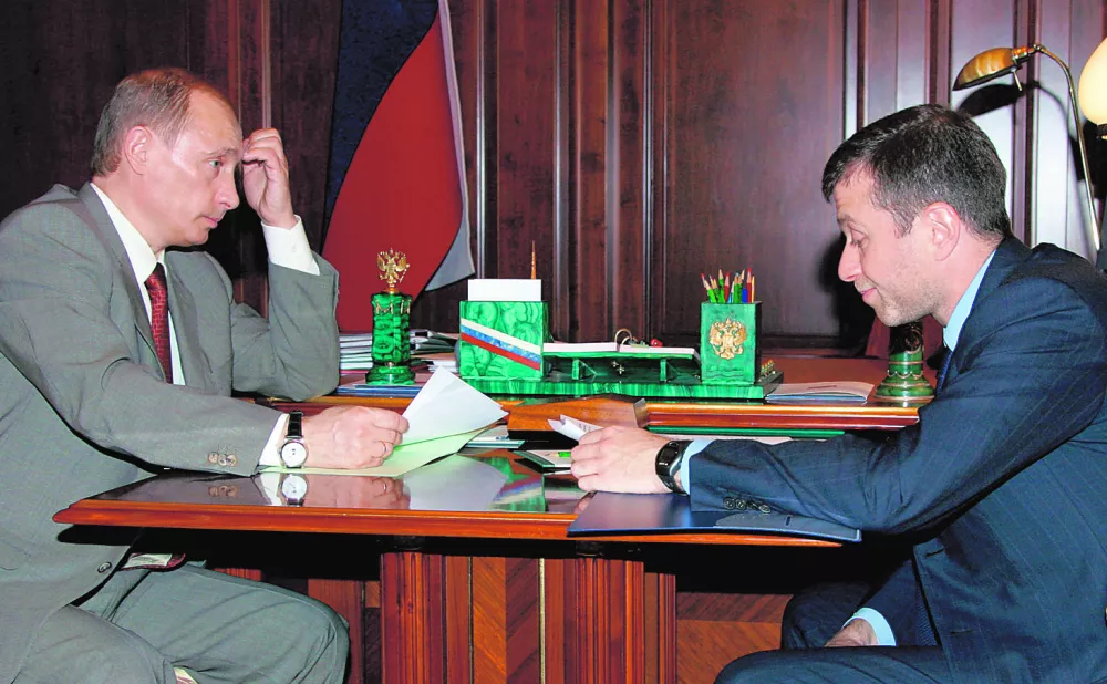 President Vladimir Putin, left, and oil tycoon Roman Abramovich seen during a meeting in the Kremlin in Moscow, Friday, May 27, 2005. Vladimir Putin met in the Kremlin Friday with Russian oil tycoon Roman Abramovich, showing measured support for the billionaire soccer club owner he is expected to nominate for a second term as governor of a remote Arctic region. (AP Photo/ITAR-TASS, Presidential Press Service)------4 kol
