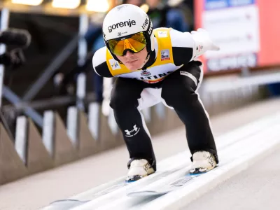 Domen Prevc of Slovenia speeds down the slope during the men's FIS Ski Jumping World Cup competition at the Gross-Titlis Schanze, in Engelberg, Switzerland, Saturday, Dec. 20, 2025. (Urs Flueeler/Keystone via AP)