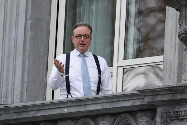 Belgium's Prime Minister Bart de Wever appears on the balcony of his office on the eve of the European Union leaders' summit, in Brussels, Belgium, December 17, 2025. REUTERS/Yves Herman