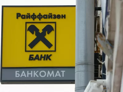 FILE PHOTO: A signboard with the logo is on display outside a branch of Raiffeisen Bank in Moscow, Russia, April 18, 2025. REUTERS/Maxim Shemetov/File Photo