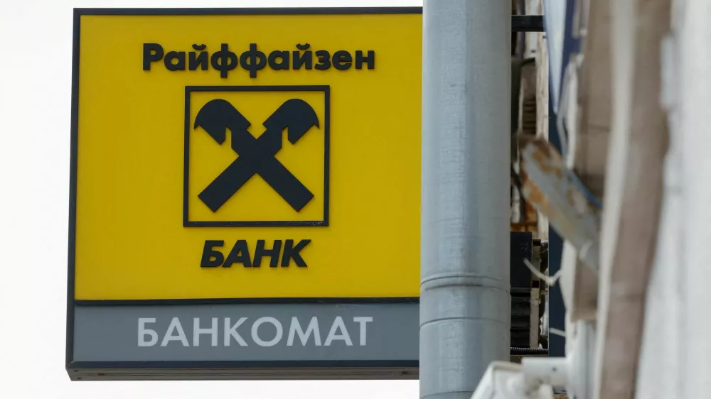 FILE PHOTO: A signboard with the logo is on display outside a branch of Raiffeisen Bank in Moscow, Russia, April 18, 2025. REUTERS/Maxim Shemetov/File Photo