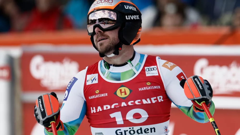 Slovenia's Miha Hrobat reacts at the finish area of an alpine ski, men's World Cup downhill, in Val Gardena, Italy, Thursday, Dec. 18, 2025. (AP Photo/Gabriele Facciotti)
