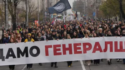 People hold a banner that reads: "We do not give army headquarters" during a protest in front of military complex that was partially destroyed in a NATO bombing campaign in 1999, after Serbian lawmakers on Friday passed a special law clearing the way for a controversial real estate project that would be financed by an investment company linked to President Trump's son-in-law Jared Kushner, in Belgrade, Serbia, Tuesday, Nov. 11, 2025. (AP Photo/Darko Vojinovic)
