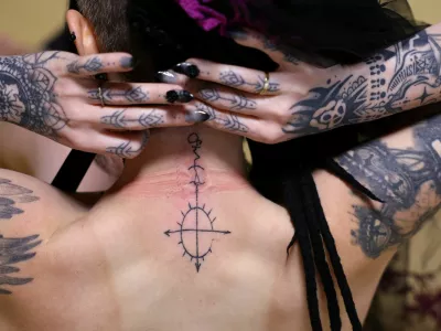 A 33-year-old Australian woman who says she is in a romantic relationship with Japanese manga character Mephisto Pheles shows a tattoo symbolizing the character before their ceremonial wedding at the traditional guest house Rinkokaku in Maebashi, Japan, March 14, 2025. REUTERS/Kim Kyung-Hoon  SEARCH "JAPAN KYUNG-HOON AI WEDDING" FOR THIS STORY. SEARCH "WIDER IMAGE" FOR ALL STORIES.