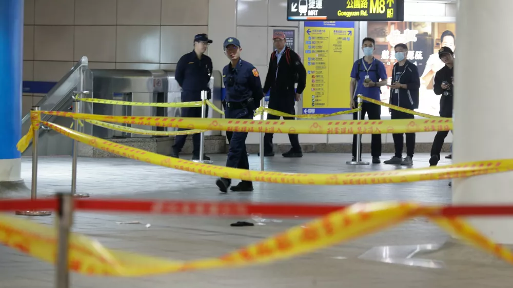 Taiwan police cordoned off the scene after a knife attack in Taipei, Taiwan, Friday, Dec. 19, 2025. (AP Photo/Chiang Ying-ying)