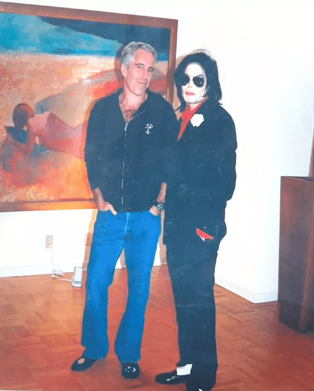 Jeffrey Epstein poses with Michael Jackson in this image released by the Department of Justice in Washington, D.C., U.S., on December 19, 2025 as part of a new trove of documents from its investigations into the late financier and convicted sex offender Jeffrey Epstein. U.S. Justice Department/Handout via REUTERS  THIS IMAGE HAS BEEN SUPPLIED BY A THIRD PARTY
