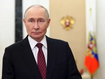 Russian President Vladimir Putin delivers a video address to congratulate officers and veterans on Security Agency Worker's Day at the Kremlin, in Moscow, on Saturday, Dec. 20, 2025. (Mikhail Metzel, Sputnik, Kremlin Pool Photo via AP)