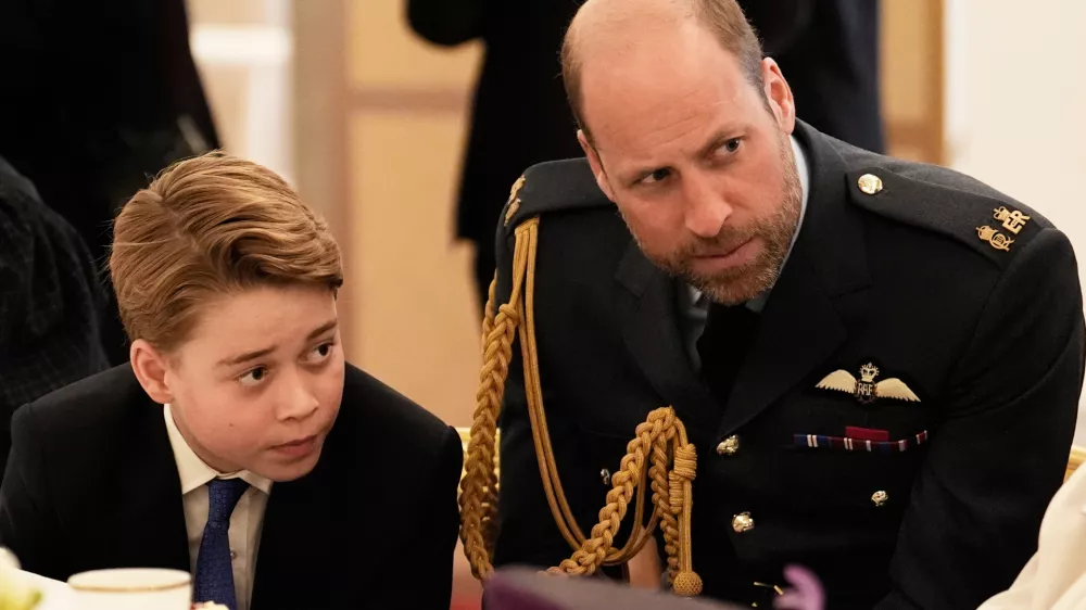 FILE - Prince William and Prince George join Second World War veterans at a tea party in Buckingham Palace, central London, Monday, May 5, 2025. (Jordan Pettitt/Pool Photo via AP, File)