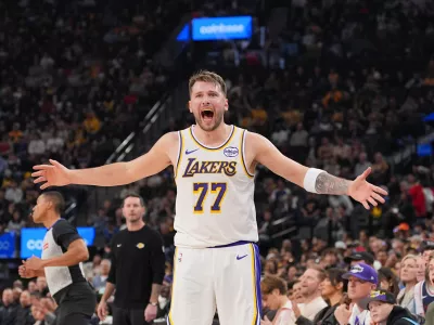 Los Angeles Lakers forward/guard Luka Doncic (77) reacts to a play during the first half of an NBA basketball game against the Los Angeles Clippers Saturday, Dec. 20, 2025, in Inglewood, Calif. (AP Photo/Jae C. Hong)