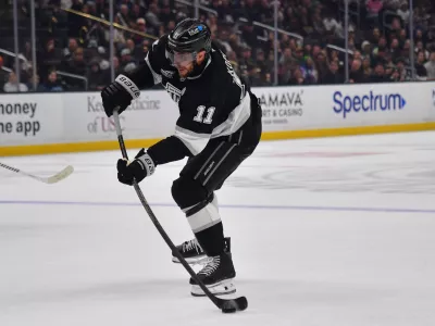 Dec 22, 2025; Los Angeles, California, USA; Los Angeles Kings center Anze Kopitar (11) shoots on goal against the Columbus Blue Jackets during the second period at Crypto.com Arena. Mandatory Credit: Gary A. Vasquez-Imagn Images