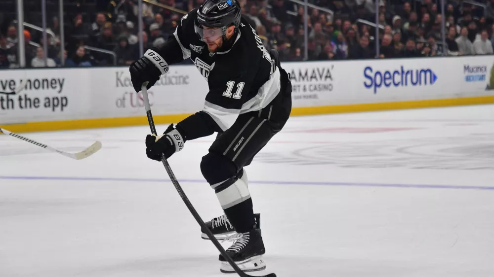Dec 22, 2025; Los Angeles, California, USA; Los Angeles Kings center Anze Kopitar (11) shoots on goal against the Columbus Blue Jackets during the second period at Crypto.com Arena. Mandatory Credit: Gary A. Vasquez-Imagn Images