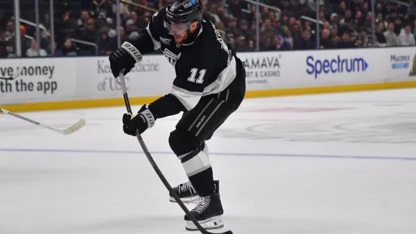 Dec 22, 2025; Los Angeles, California, USA; Los Angeles Kings center Anze Kopitar (11) shoots on goal against the Columbus Blue Jackets during the second period at Crypto.com Arena. Mandatory Credit: Gary A. Vasquez-Imagn Images