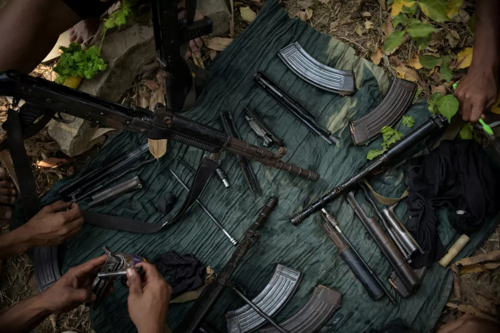 FILE PHOTO: Members of Bamar People's Liberation Army (BPLA), who recently came back from a frontline, clean their guns in territory belonging to the Karen National Liberation Army (KNLA), in Karen State, Myanmar, March 8, 2024. Representing Myanmar's Bamar ethnic majority, the BPLA was formed in April 2021 to fight the junta after it toppled an elected government in February that year. Since October, the group has been a key player in Operation 1027, a joint offensive with other rebel militias that has significantly weakened the military.REUTERS/Stringer SEARCH "MYANMAR BPLA ARMY" FOR THIS STORY. SEARCH "WIDER IMAGE" FOR ALL STORIES./File Photo