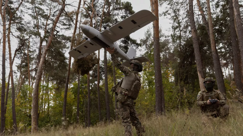 Ukrainian soldiers prepare to launch an Avenger UAV drone in Ukraine's Kharkiv region, Wednesday, Sept. 24, 2025. (AP Photo/Yevhen Titov)