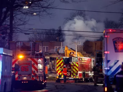 First responders work the scene of an explosion and fire at Bristol Health & Rehab Center, Tuesday, Dec. 23, 2025, in Bristol, Pa. (Monica Herndon/The Philadelphia Inquirer via AP)