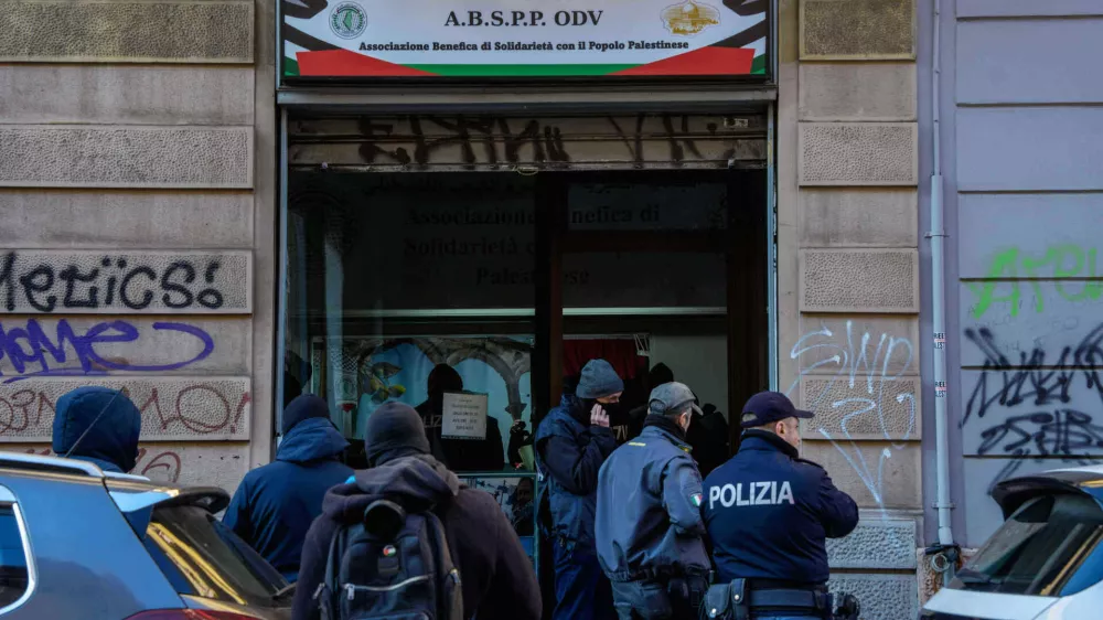 Police officers inspect a charitable association supporting Palestinian civilians in Milan, Italy, Saturday, Dec. 27, 2025 after Italian investigators have arrested nine people suspected of raising millions of euros for Hamas. (Claudio Furlan/LaPresse via AP)