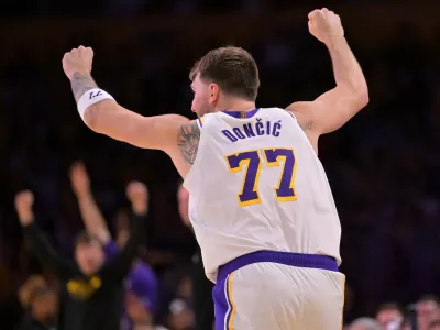 Dec 28, 2025; Los Angeles, California, USA; Los Angeles Lakers guard Luka Doncic (77) reacts after a 3-point basket in the second half against the Sacramento Kings at Crypto.com Arena. Mandatory Credit: Jayne Kamin-Oncea-Imagn Images