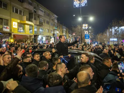Kosovo's acting Prime Minister and leader of VeteVendosje political party Albin Kurti greets his supporters in Kosovo's capital Pristina, Sunday Dec. 28, 2025. (AP Photo/Visar Kryeziu)