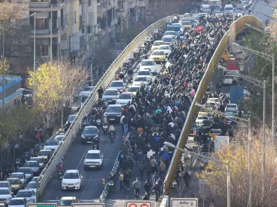 Protesters march in downtown Tehran, Iran, Monday, Dec. 29, 2025. (Fars News Agency via AP)