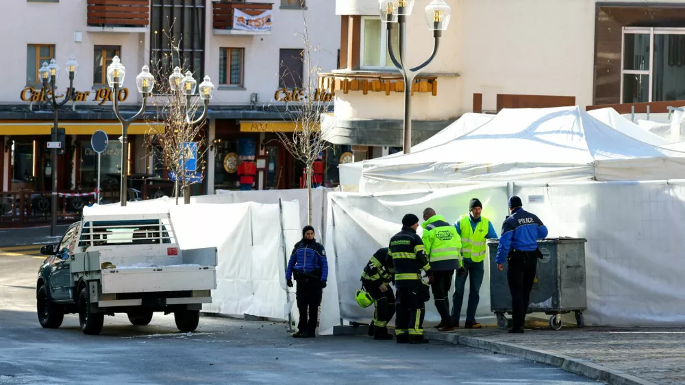 Emergency personnel work at the site of an explosion and fire at the "Le Constellation" bar, where several people died and others were injured after an explosion tore through a crowded New Year's Eve party, according to Swiss police, in the upscale ski resort of Crans-Montana in southwestern Switzerland, January 1, 2026. REUTERS/Denis Balibouse   TPX IMAGES OF THE DAY