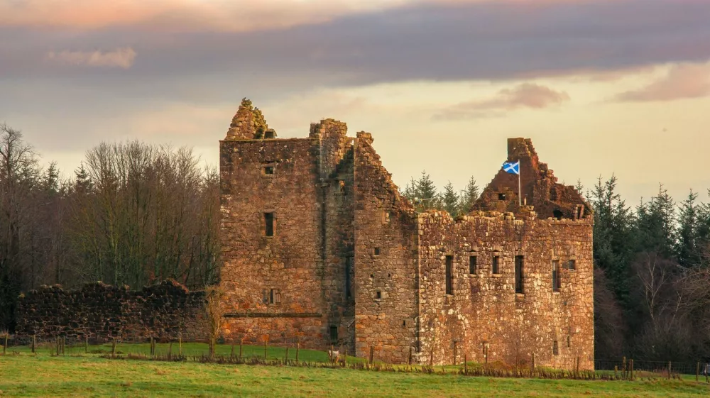 Torwood Castle on an autumnal day. With the saltire flag flying.,Image: 1056640388, License: Rights-managed, Restrictions:, Model Release: no