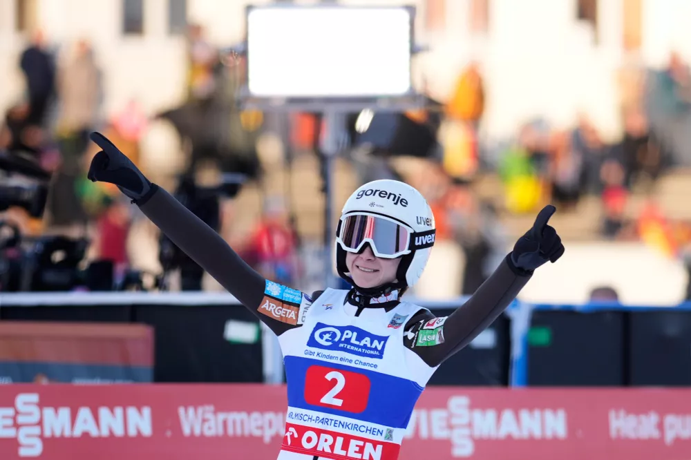 Nika Prevc, of Slovenia, reacts after her second round jump at the women's ski jumping World Cup competition in Garmisch-Partenkirchen, Germany, Wednesday, Dec. 31, 2025. (AP Photo/Matthias Schrader)