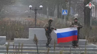 Soldiers hold a Russian flag in Pokrovsk, Donetsk Region, Ukraine, in this screengrab from video released December 1, 2025. Russian Defence Ministry/Handout via REUTERS  THIS IMAGE HAS BEEN SUPPLIED BY A THIRD PARTY. MUST NOT OBSCURE LOGO. VERIFICATION: - Reuters was able to confirm the location of the video as Pokrovsk from the buildings, the road layout and trees which matched file and satellite imagery of the area. - The date when the video was recorded could not be verified independently.