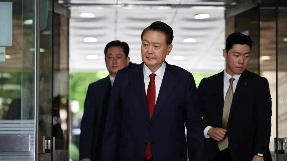 FILE PHOTO: Former South Korean President Yoon Suk Yeol arrives at a court to attend a hearing to review his arrest warrant requested by special prosecutors in Seoul, South Korea, July 9, 2025.  REUTERS/Kim Hong-Ji/Pool/File Photo