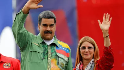 FILE PHOTO: Venezuela's President Nicolas Maduro and his wife Cilia Flores greet supporters during his closing campaign rally in Caracas, Venezuela May 17, 2018. REUTERS/Carlos Jasso/File Photo