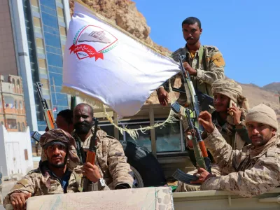 Government soldiers ride on the back of a pick-up truck in the Arabian Sea port city of Mukalla, as the Saudi-backed, internationally recognized government said it had retaken control of the key eastern port and capital of Hadramout province, from the southern separatists, Yemen January 4, 2026. REUTERS/Stringer   TPX IMAGES OF THE DAY