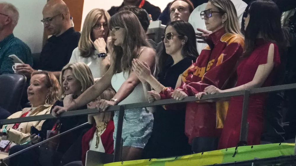 Taylor Swift, from left, Alana Haim, Este Haim and Danielle Haim watches action during the first half of the NFL Super Bowl 59 football game between the Kansas City Chiefs and the Philadelphia Eagles, Sunday, Feb. 9, 2025, in New Orleans. (AP Photo/Gerald Herbert)