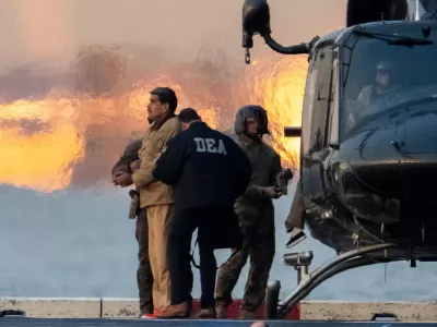Captured Venezuelan President Nicolas Maduro is escorted, as he heads towards the Daniel Patrick Moynihan United States Courthouse in Manhattan for an initial appearance to face U.S. federal charges including narco-terrorism, conspiracy, drug trafficking, money laundering and others at Downtown Manhattan Heliport, in New York City, U.S., January 5, 2026. REUTERS/Adam Gray