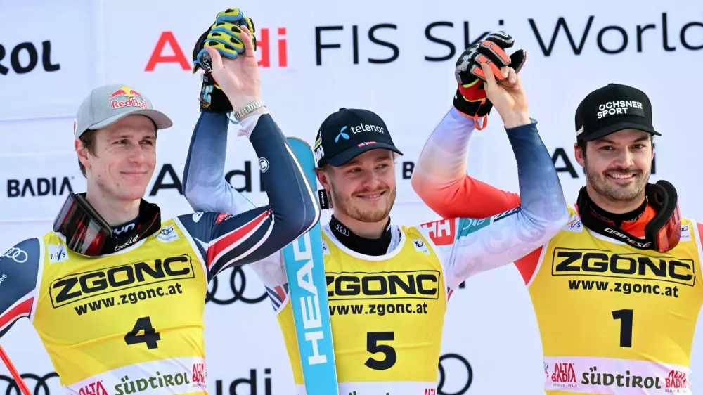 Alpine Skiing - FIS Alpine Ski World Cup - Men's Slalom - Alta Badia, Italy - December 22, 2025 Norway's Atle Lie McGrath celebrates during the medal ceremony after winning Men's Slalom along with second placed France's Clement Noel and third placed Switzerland's Loic Meillard REUTERS/Angelika Warmuth