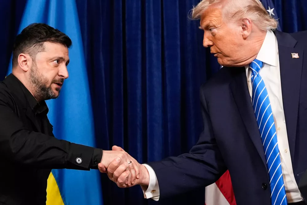 President Donald Trump and Ukraine's President Volodymyr Zelenskyy shake hands at the start of a joint news conference following a meeting at Trump's Mar-a-Lago club, Sunday, Dec. 28, 2025, in Palm Beach, Fla. (AP Photo/Alex Brandon)