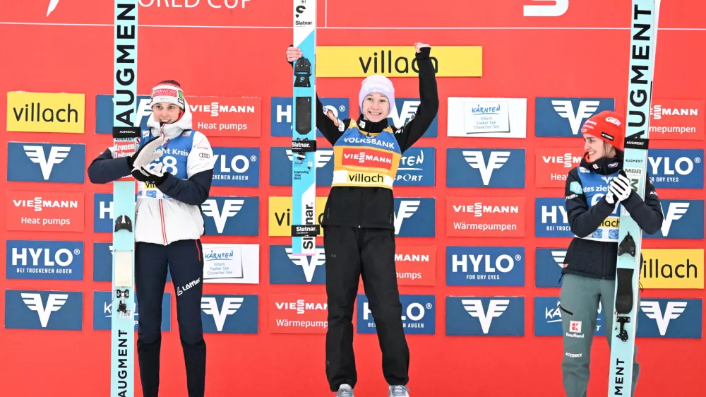 05 January 2026, Austria, Villach: (L-R) Austria's second placed Lisa Eder, Slovenia's winner Nika Prevc and Germany's third placed Selina Freitag celebrate on the podium after the 2nd competition round at the Women's Ski Jumping FIS World Cup in Villach. Photo: Barbara Gindl/APA/dpa