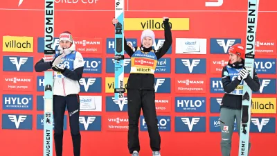 05 January 2026, Austria, Villach: (L-R) Austria's second placed Lisa Eder, Slovenia's winner Nika Prevc and Germany's third placed Selina Freitag celebrate on the podium after the 2nd competition round at the Women's Ski Jumping FIS World Cup in Villach. Photo: Barbara Gindl/APA/dpa