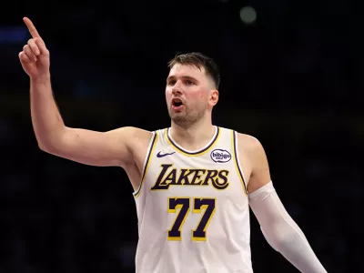 Jan 4, 2026; Los Angeles, California, USA; Los Angeles Lakers guard Luka Doncic (77) reacts to a play during the third quarter against the Memphis Grizzlies at Crypto.com Arena. Mandatory Credit: Kiyoshi Mio-Imagn Images
