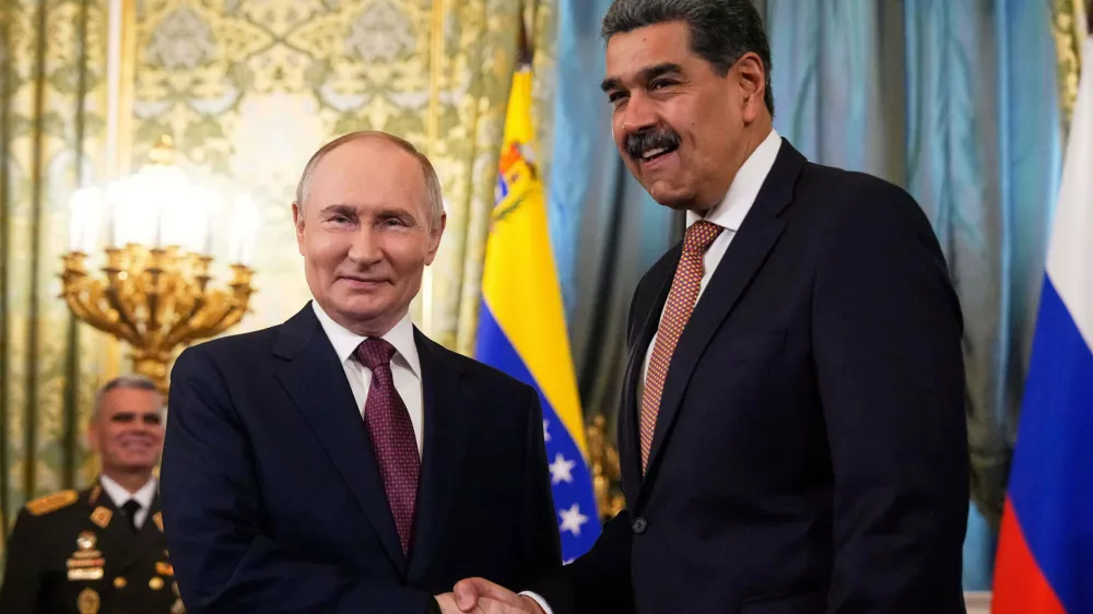 FILE - Russian President Vladimir Putin, left, shakes hands with Venezuelan President Nicolas Maduro during their meeting at the Kremlin in Moscow, Russia, Wednesday, May 7, 2025, ahead of celebrations of the 80th anniversary of the Soviet Union's victory over Nazi Germany during the World War II. (AP Photo/Alexander Zemlianichenko, file)