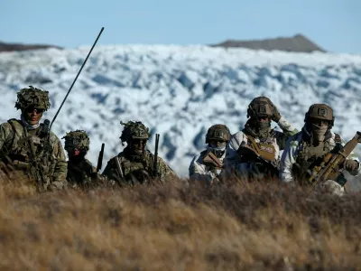 FILE PHOTO: Danish troops practice looking for potential threats during a military drill as Danish, Swedish and Norwegian home guard units together with Danish, German and French troops take part in joint military drills in Kangerlussuaq, Greenland, September 17, 2025. REUTERS/Guglielmo Mangiapane/File Photo