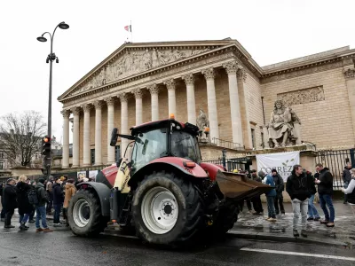 A tractor is parked in front of the National Assembly as French farmers protest against the government's handling of the EU-Mercosur free trade agreement and the handling of the lumpy skin disease outbreak, in Paris, France, January 8, 2026. REUTERS/Benoit Tessier