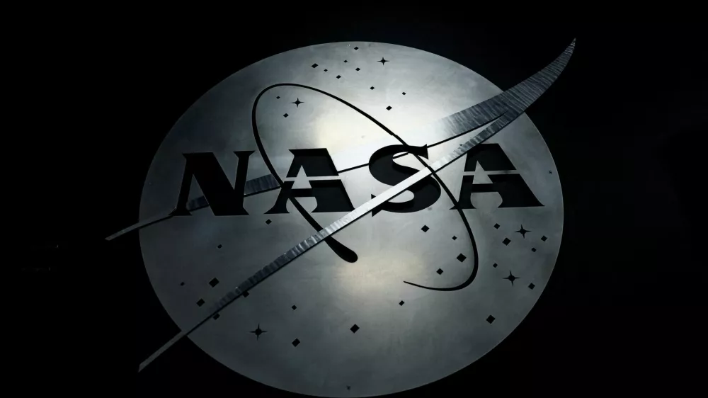 FILE PHOTO: The NASA logo hangs in the Mission Operations Control Center at Wallops Flight Facility on Wallops Island, Virginia, U.S., October 26, 2022. REUTERS/Evelyn Hockstein/File Photo