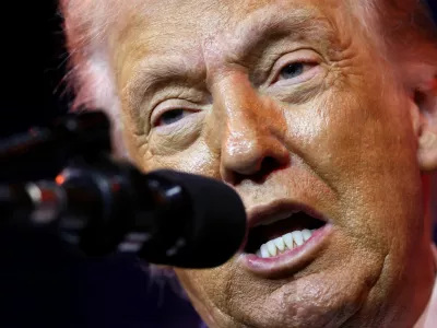 FILE PHOTO: U.S. President Donald Trump addresses House Republicans at their annual issues conference retreat, at the Kennedy Center, renamed the Trump-Kennedy Center by the Trump-appointed board of directors, in Washington, D.C., U.S., January 6, 2026. REUTERS/Kevin Lamarque/File Photo